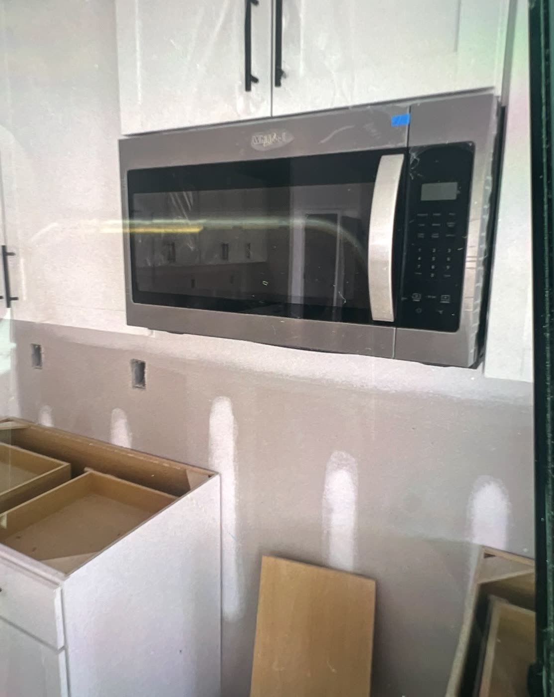 Over-range microwave installed by AM&J